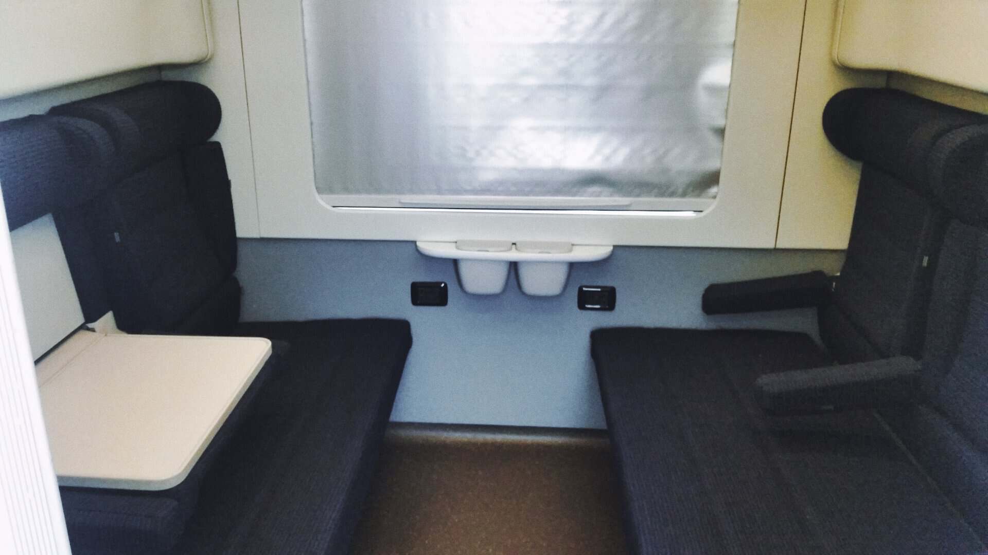 Trenitalia Intercity Notte couchette car: view with seats and folded-up beds